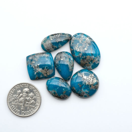 Nacozari turquoise cabochons are striking gemstones known for their vibrant blue to greenish-blue colors and pyrite, these stones are prized in jewelry making.