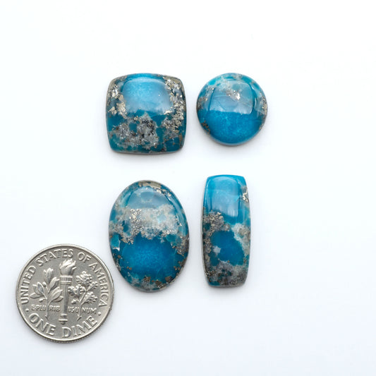 Nacozari turquoise cabochons are striking gemstones known for their vibrant blue to greenish-blue colors and pyrite, these stones are prized in jewelry making.