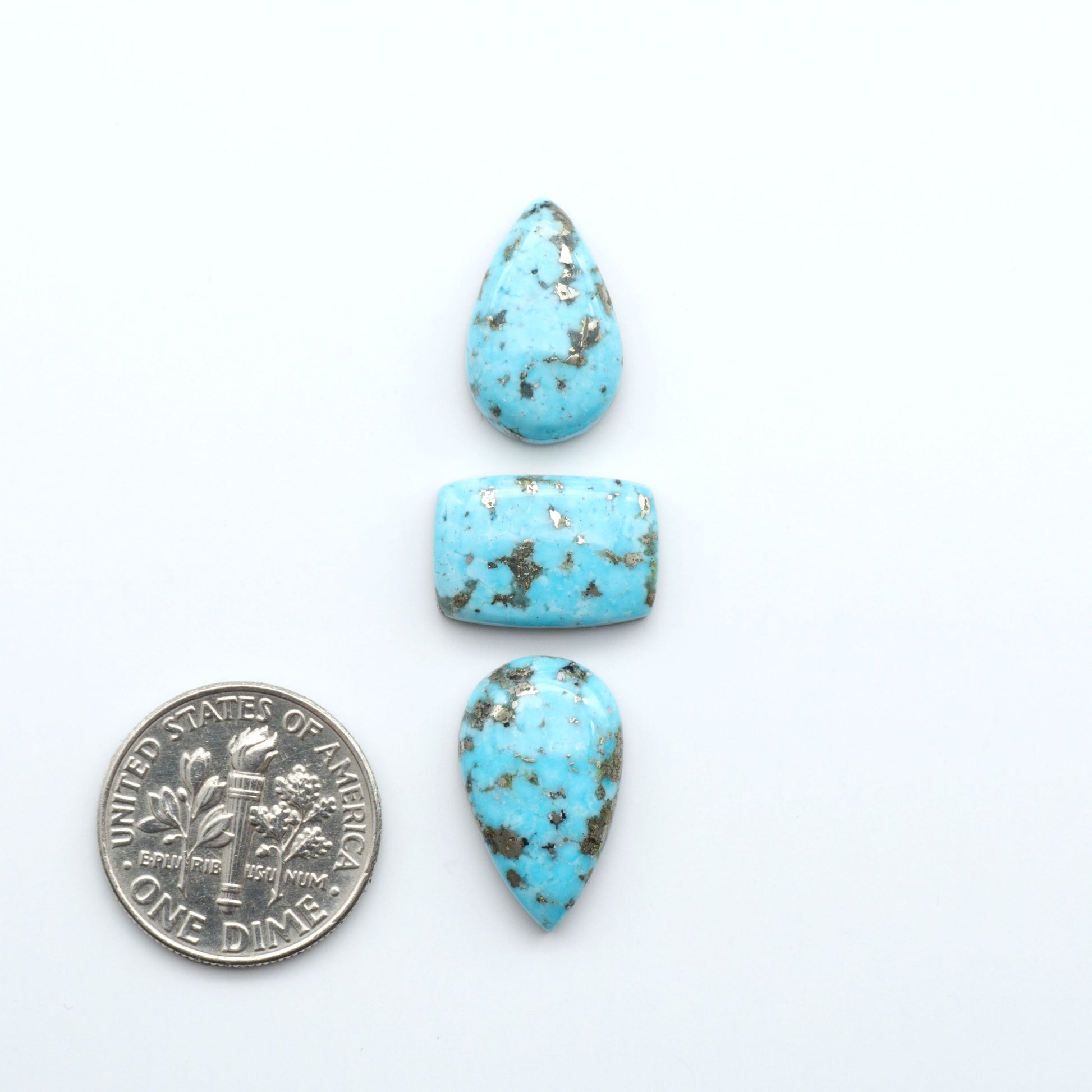 Nacozari turquoise cabochons are striking gemstones known for their vibrant blue to greenish-blue colors and pyrite, these stones are prized in jewelry making.