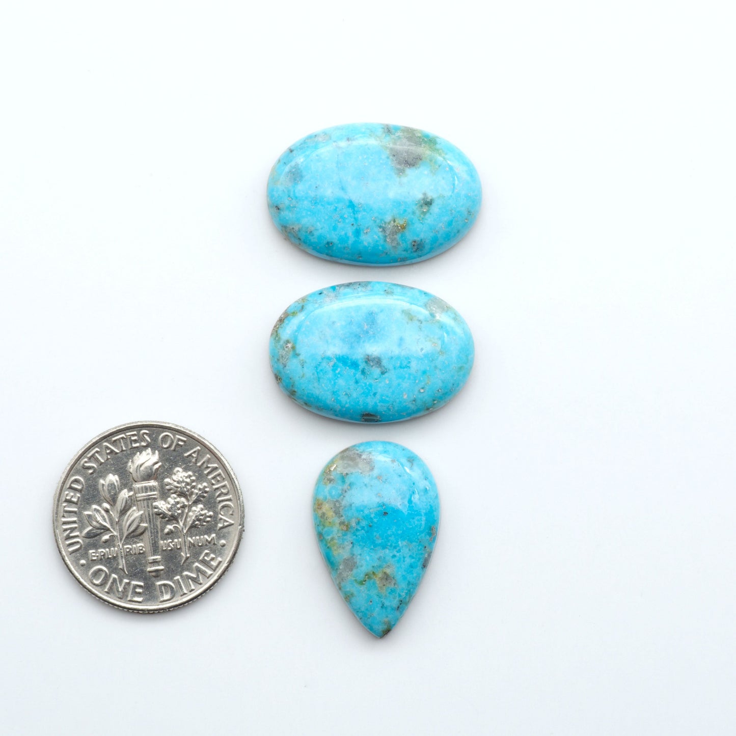 Nacozari turquoise cabochons are striking gemstones known for their vibrant blue to greenish-blue colors and pyrite, these stones are prized in jewelry making.