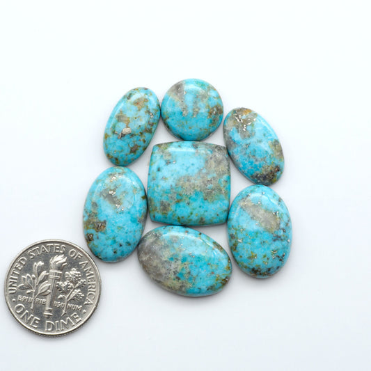 Nacozari turquoise cabochons are striking gemstones known for their vibrant blue to greenish-blue colors and pyrite, these stones are prized in jewelry making.