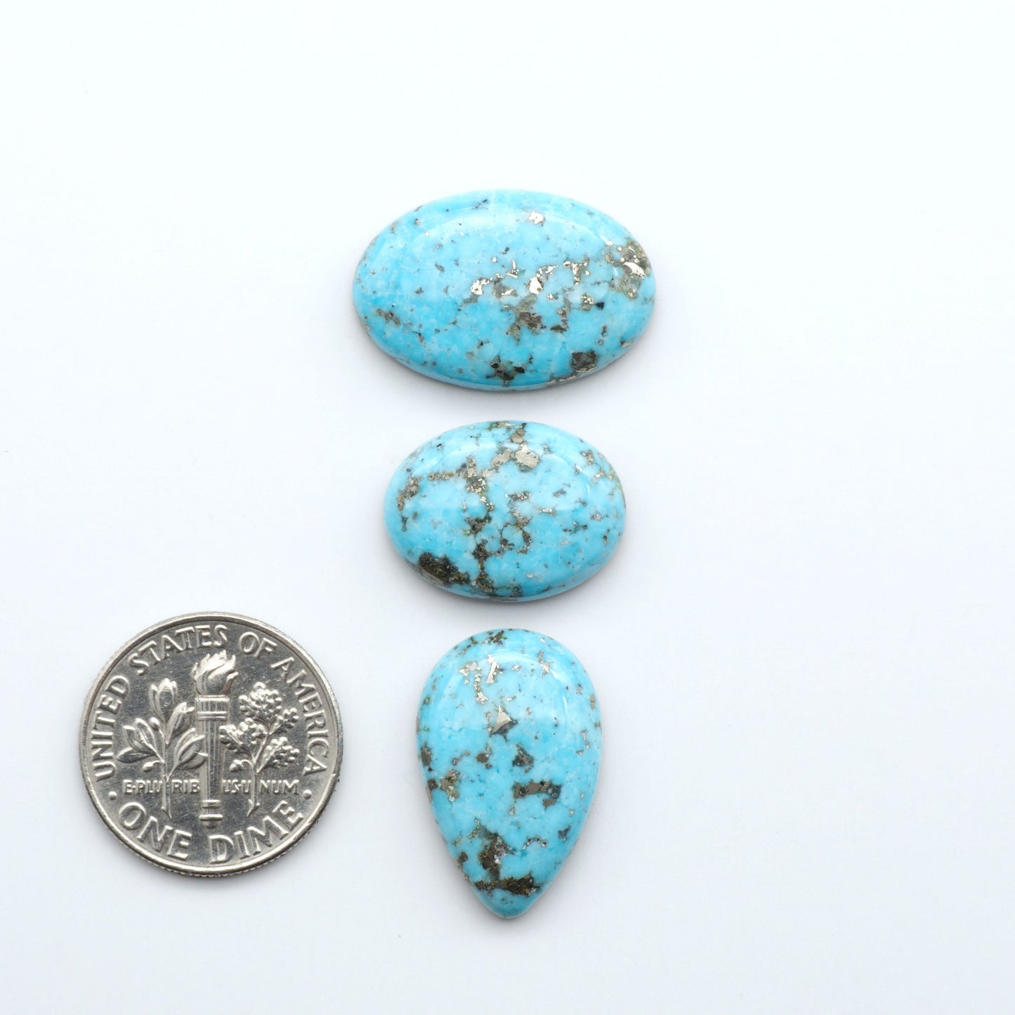 Nacozari turquoise cabochons are striking gemstones known for their vibrant blue to greenish-blue colors and pyrite, these stones are prized in jewelry making.
