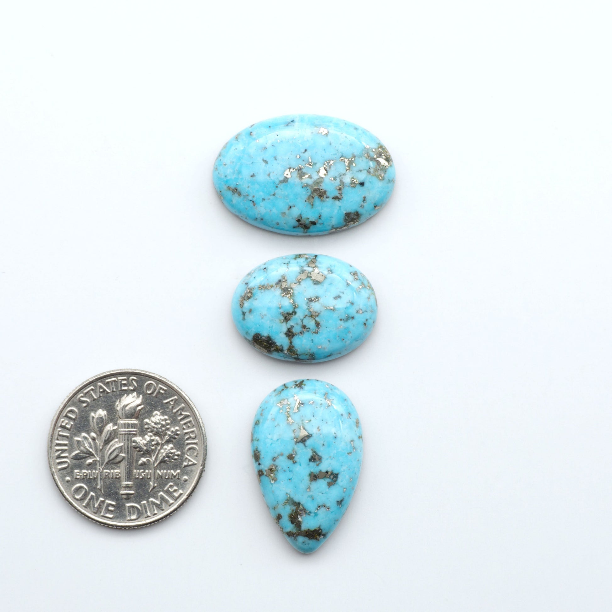 Nacozari turquoise cabochons are striking gemstones known for their vibrant blue to greenish-blue colors and pyrite, these stones are prized in jewelry making.