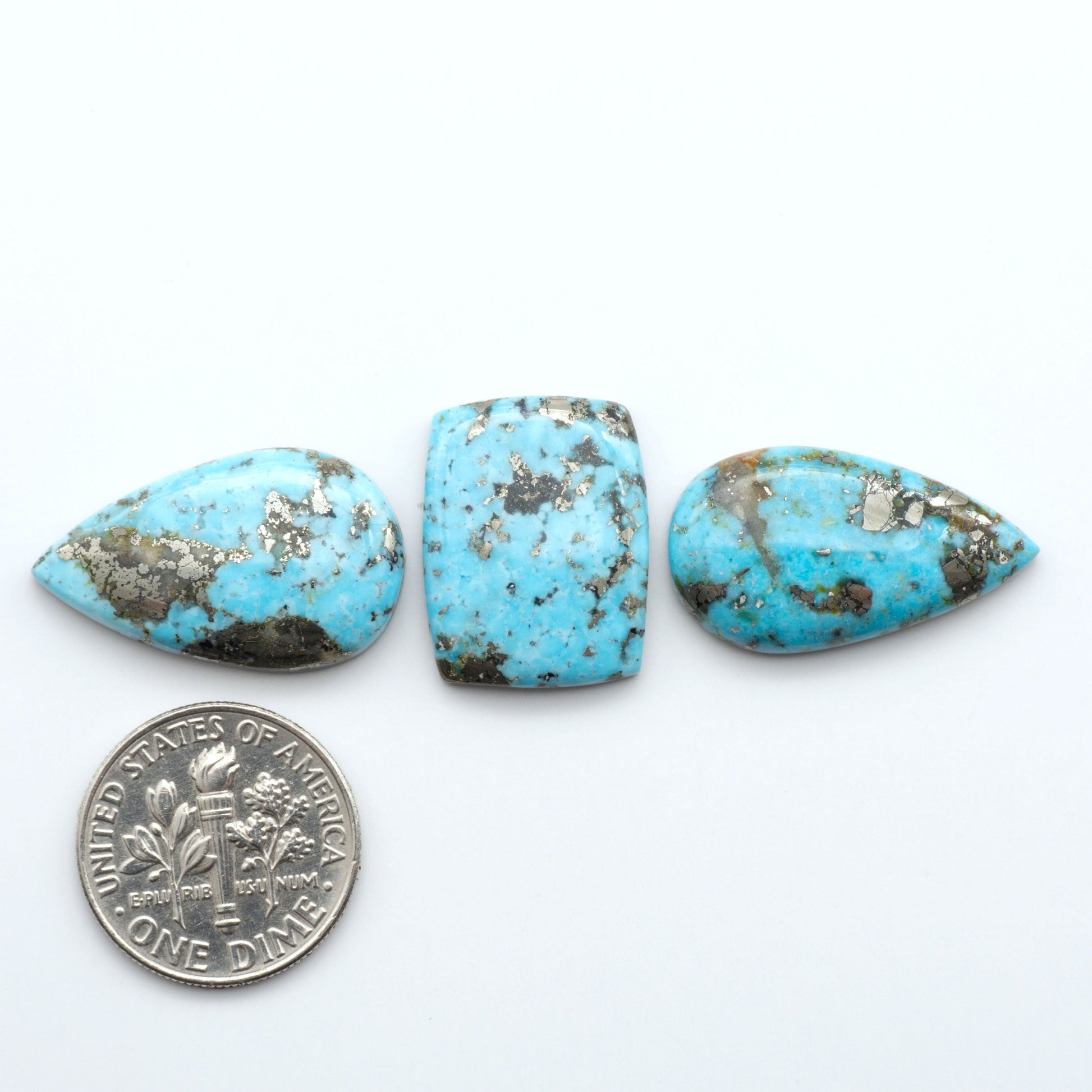 Nacozari turquoise cabochons are striking gemstones known for their vibrant blue to greenish-blue colors and pyrite, these stones are prized in jewelry making.