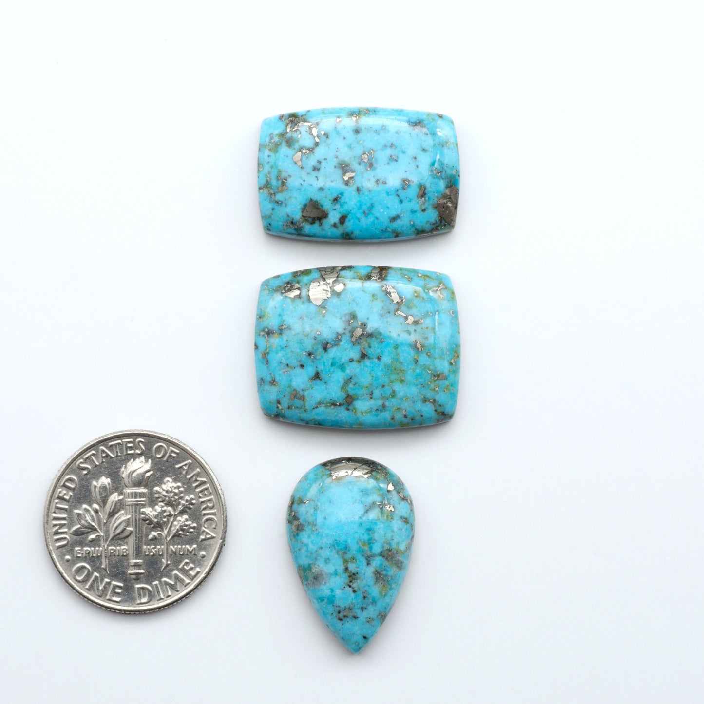 Nacozari turquoise cabochons are striking gemstones known for their vibrant blue to greenish-blue colors and pyrite, these stones are prized in jewelry making.