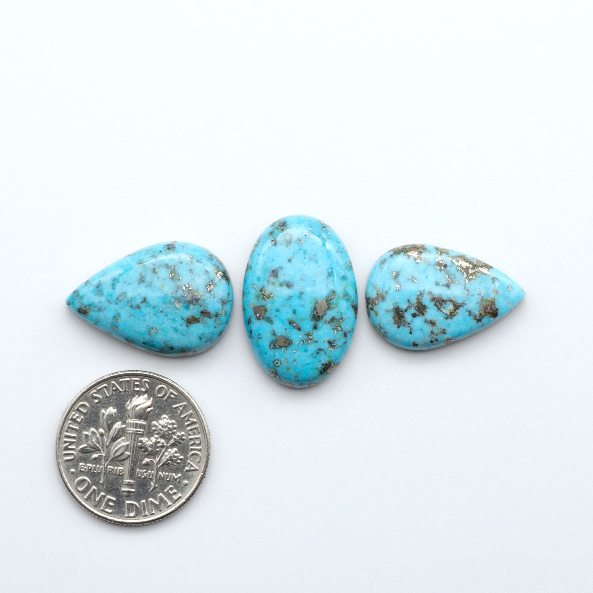 Nacozari turquoise cabochons are striking gemstones known for their vibrant blue to greenish-blue colors and pyrite, these stones are prized in jewelry making.