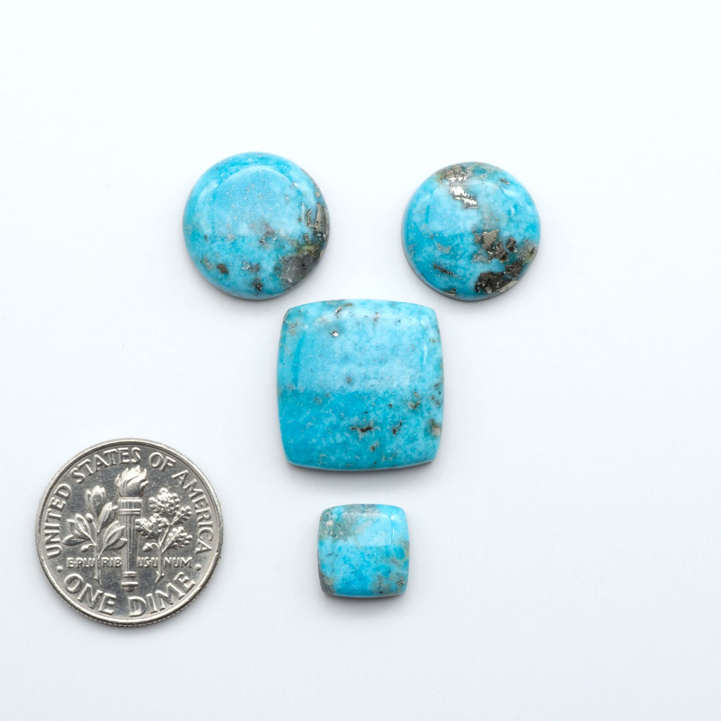 Nacozari turquoise cabochons are striking gemstones known for their vibrant blue to greenish-blue colors and pyrite, these stones are prized in jewelry making.