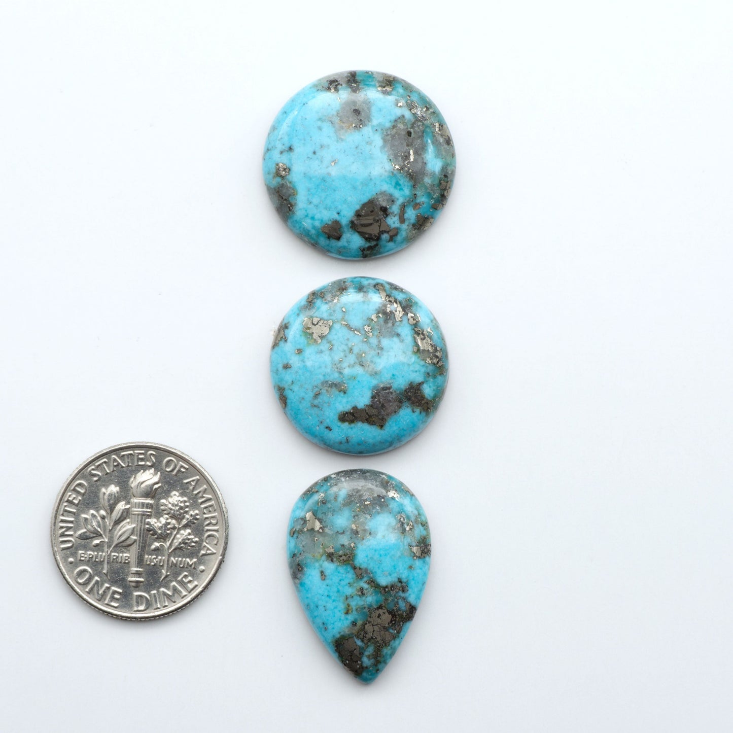 Nacozari turquoise cabochons are striking gemstones known for their vibrant blue to greenish-blue colors and pyrite, these stones are prized in jewelry making.