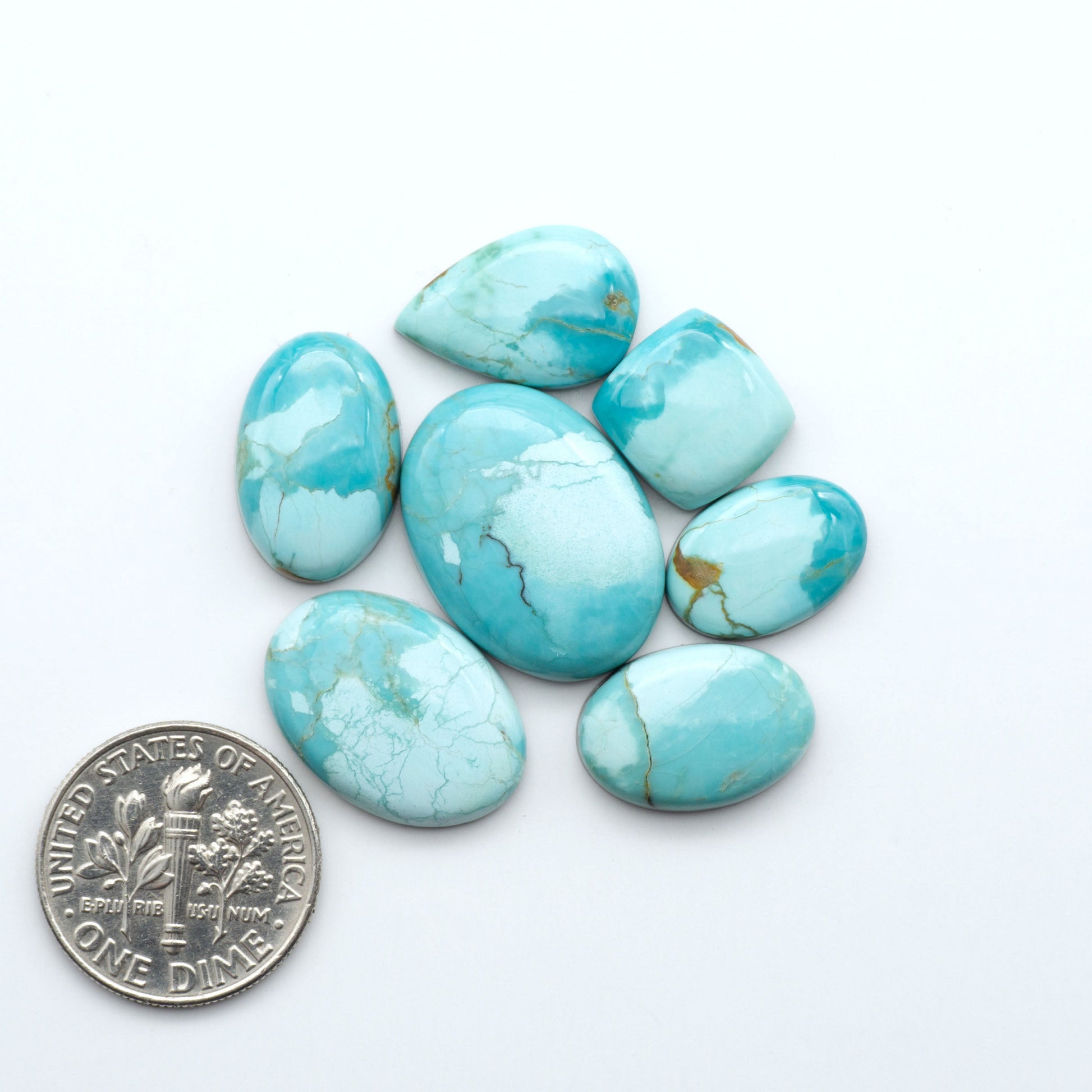 Add a touch of beauty to your collection with our stunning Pilot Mountain Turquoise Cabochons. Perfect for jewelry making each piece is truly one-of-a-kind.