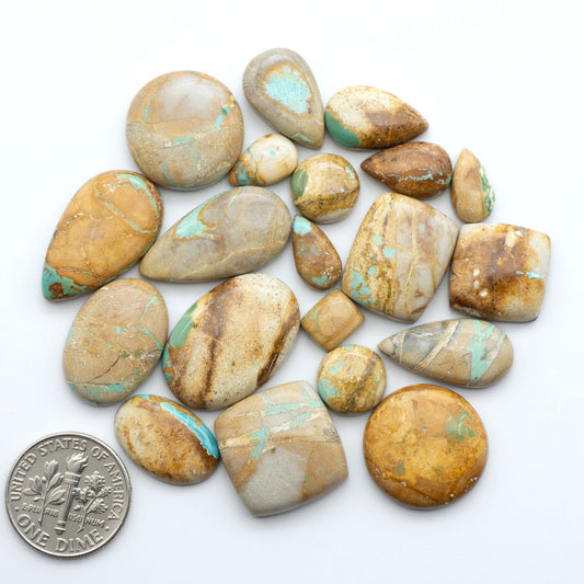 Royston Turquoise cabochons are famous for their distinctive matrix and unique green and blue hues, making them a favored option among jewelry designers.