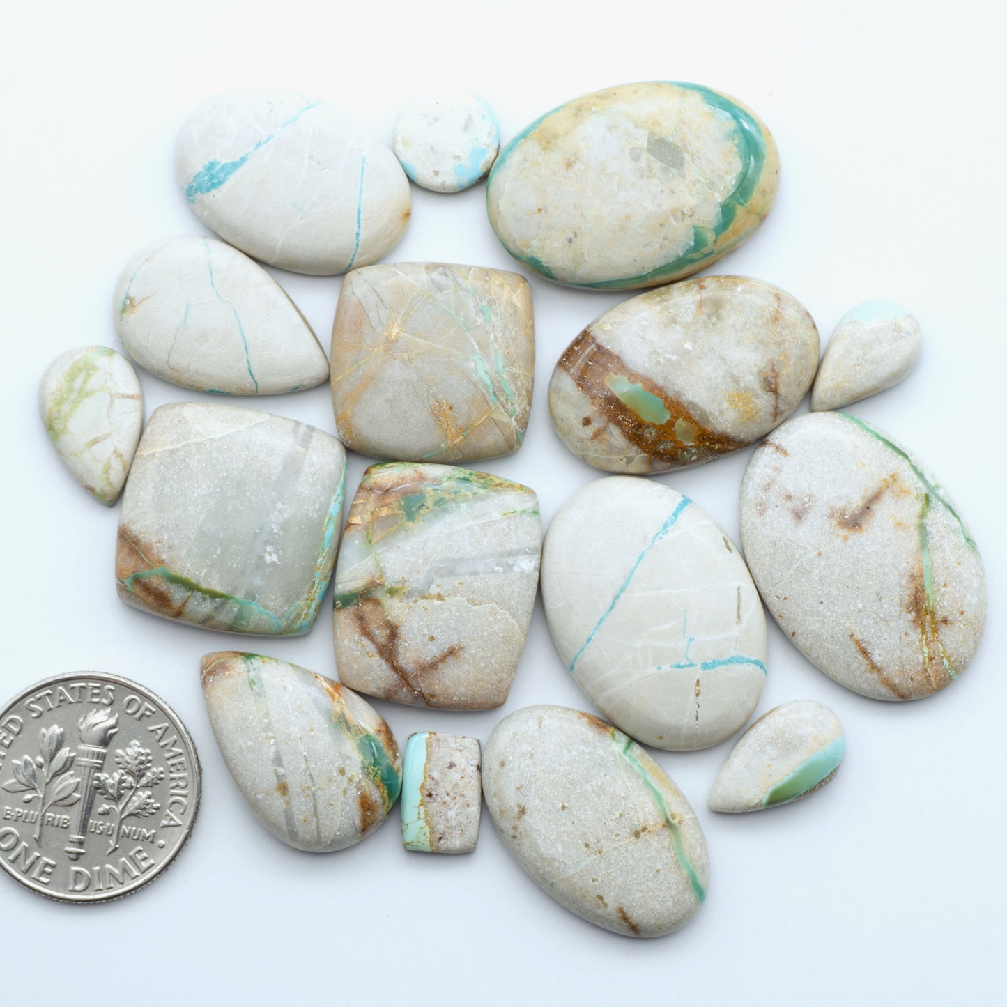 Royston Turquoise cabochons are famous for their distinctive matrix and unique green and blue hues, making them a favored option among jewelry designers.