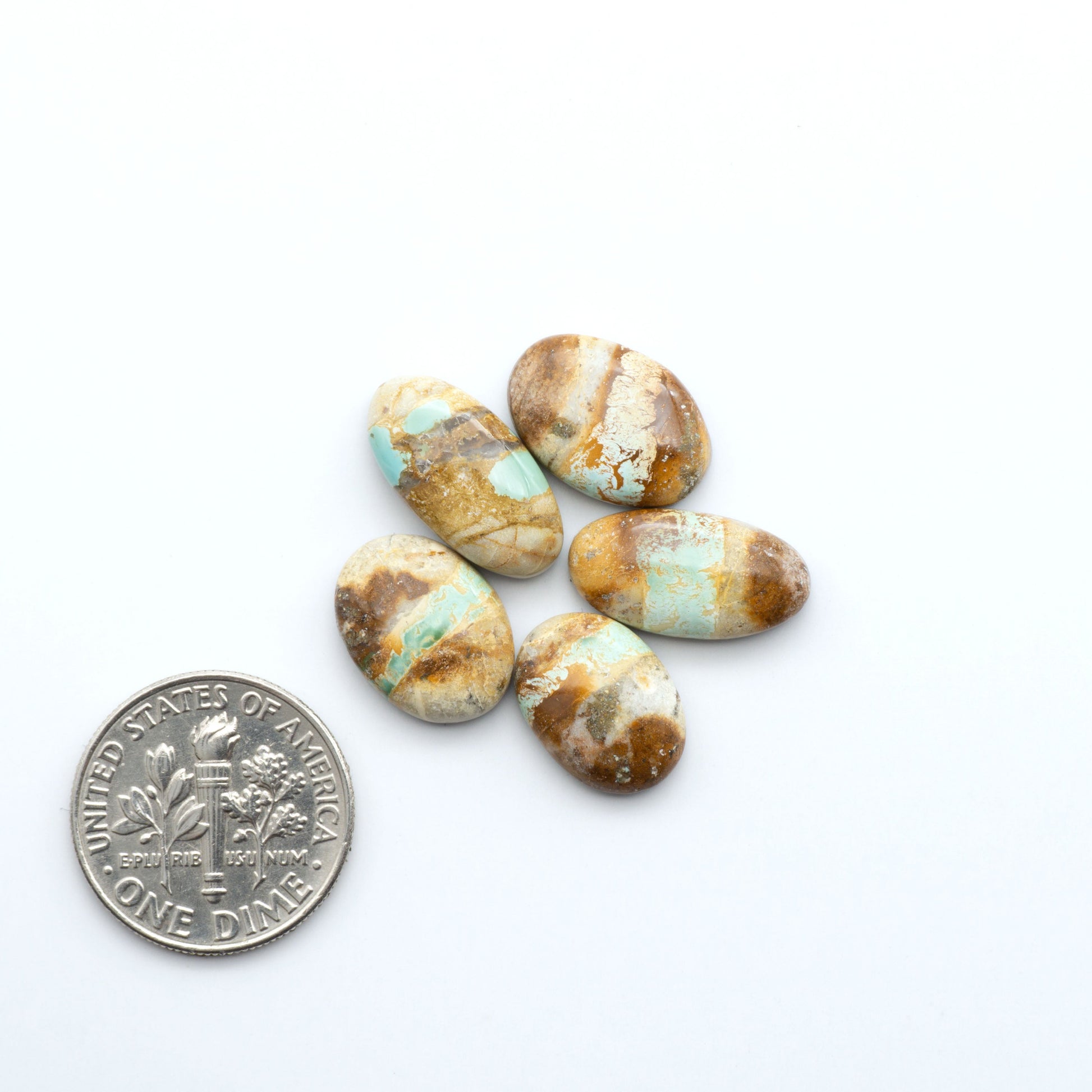 Royston Turquoise cabochons are famous for their distinctive matrix and unique green and blue hues, making them a favored option among jewelry designers.