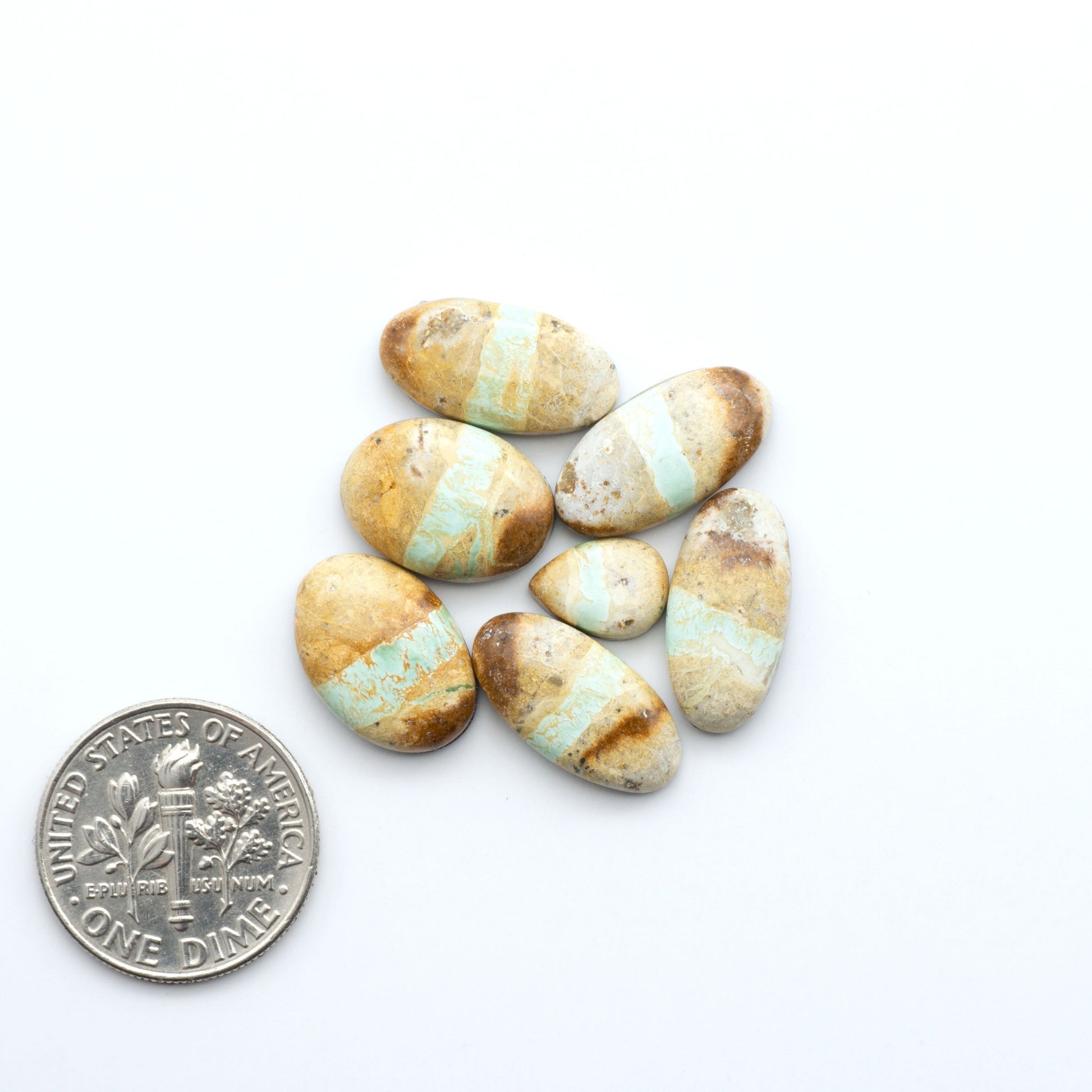 Royston Turquoise cabochons are famous for their distinctive matrix and unique green and blue hues, making them a favored option among jewelry designers.