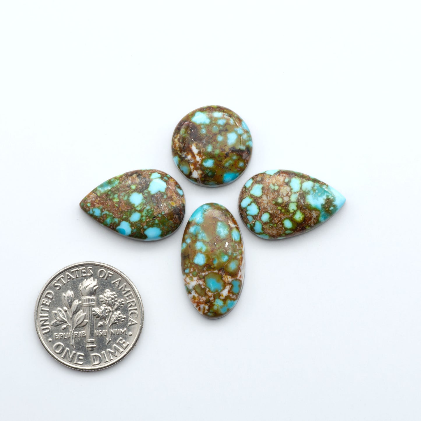 Kingman Turquoise Cabochons are a staple in the jewelry industry, known for their stunning blue-green color. Perfect for necklaces, earrings, and more!