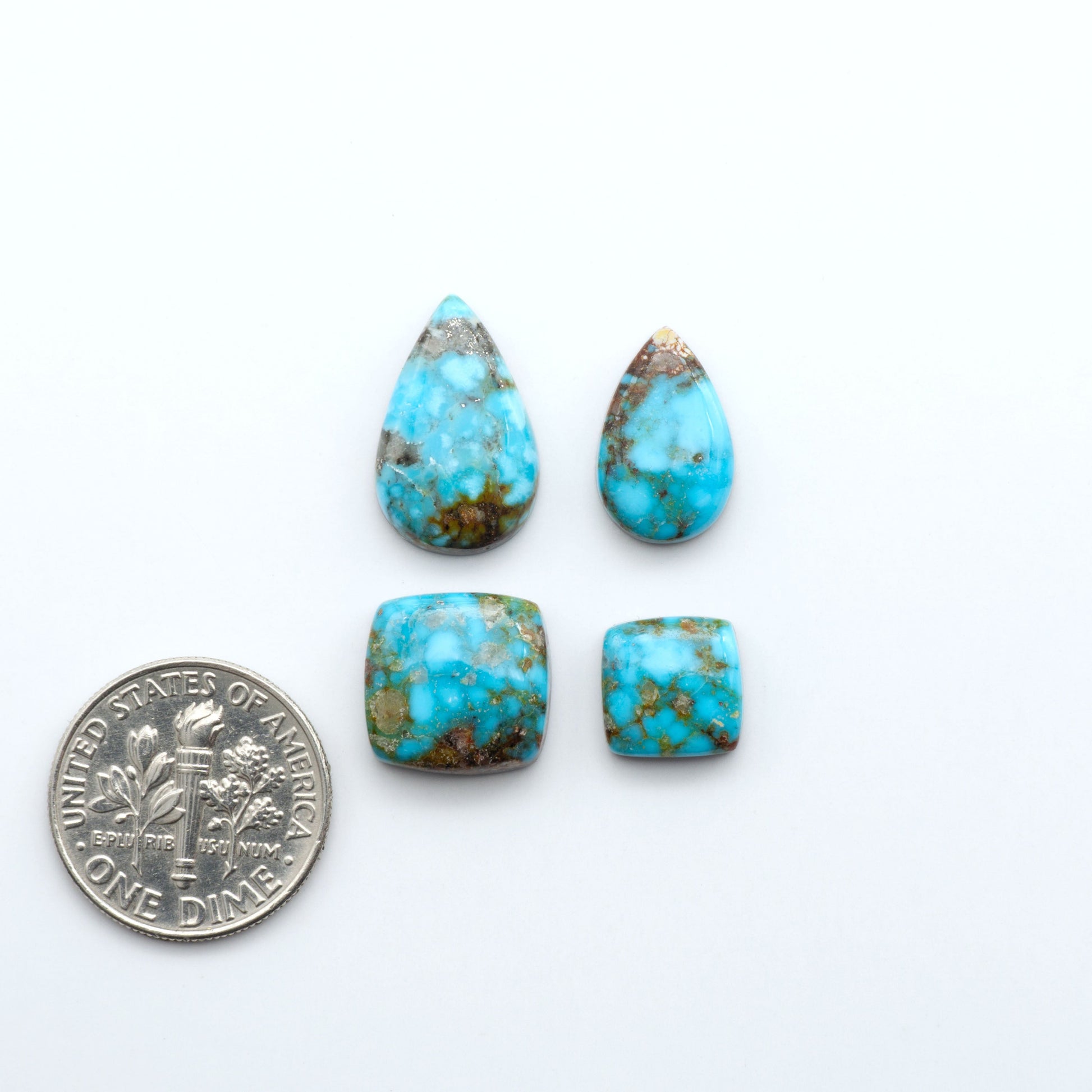 Kingman Turquoise Cabochons are a staple in the jewelry industry, known for their stunning blue-green color. Perfect for necklaces, earrings, and more!
