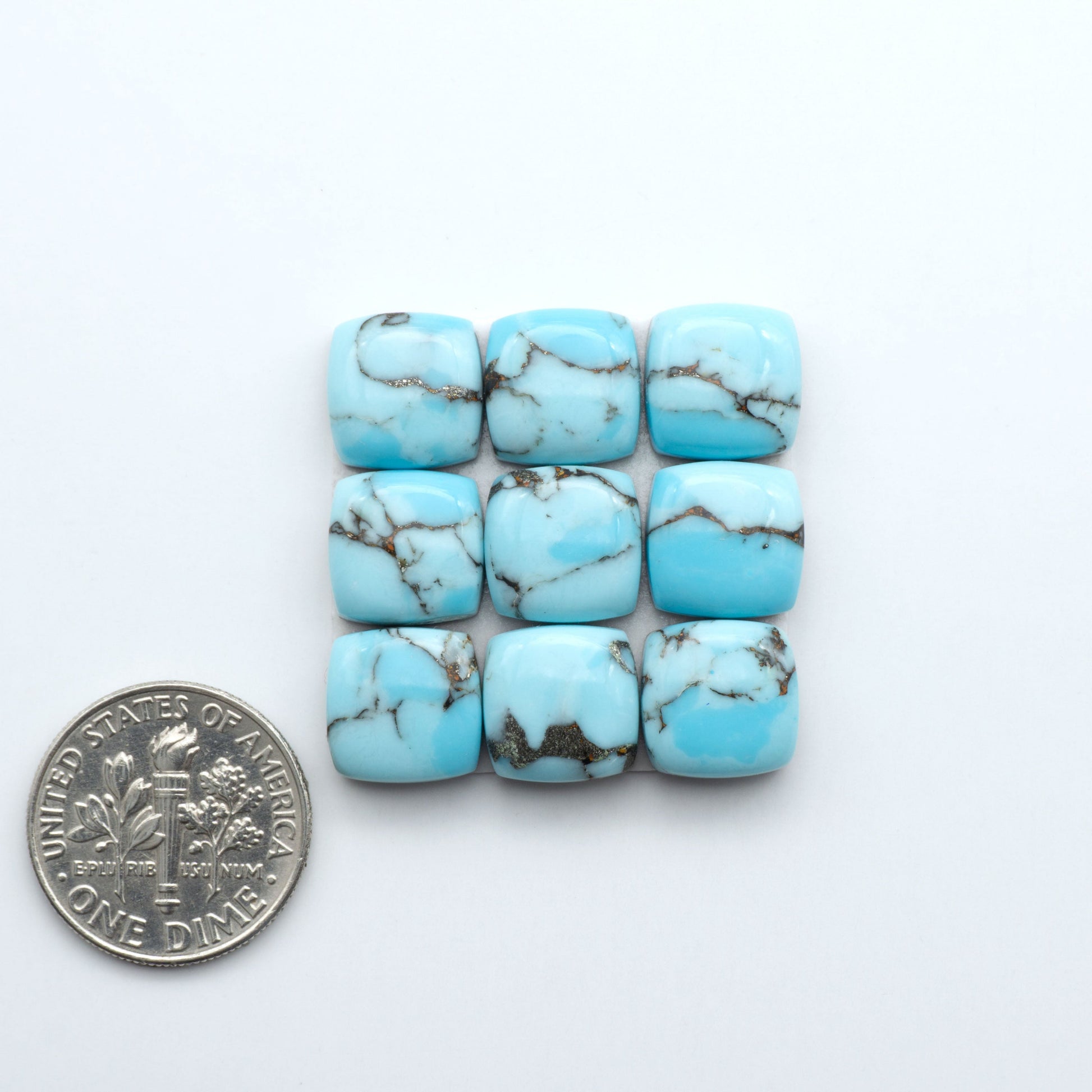 Enhance your jewelry designs with Pressed Turquoise Nugget Cabochons. Crafted from composite materials they add a captivating touch to your creations.