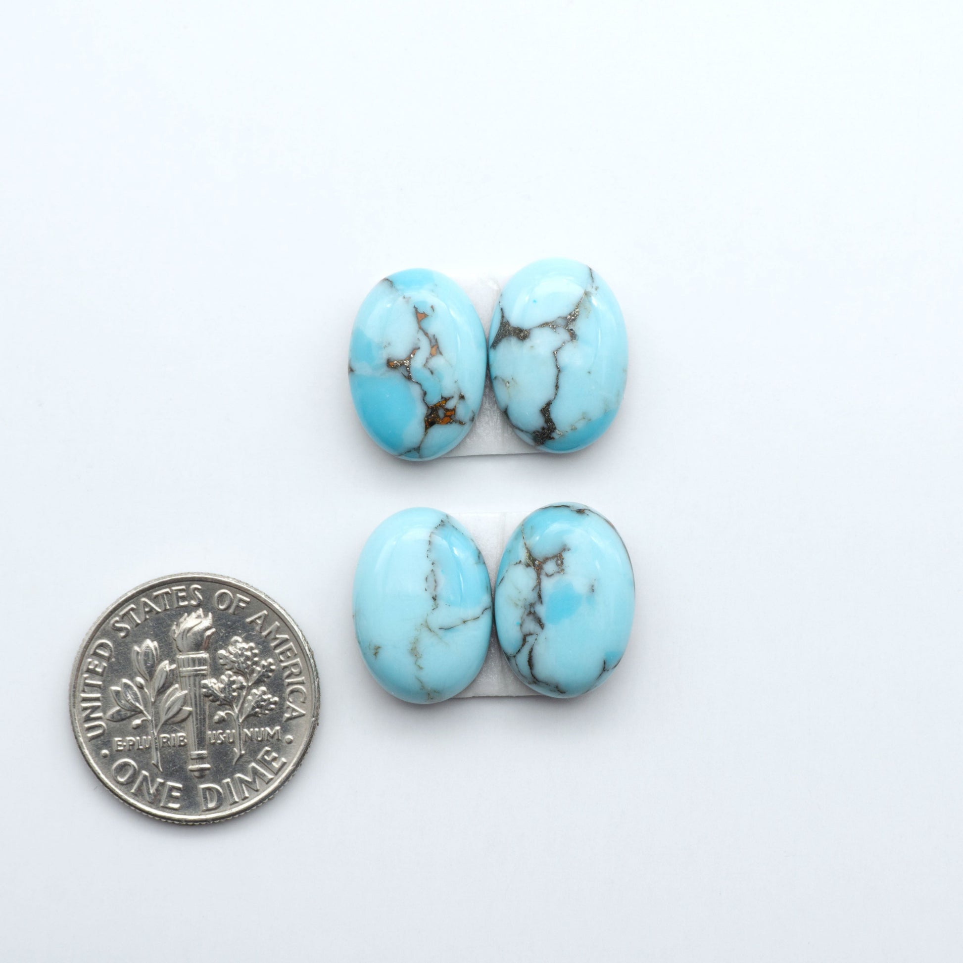 Enhance your jewelry designs with Pressed Turquoise Nugget Cabochons. Crafted from composite materials they add a captivating touch to your creations.