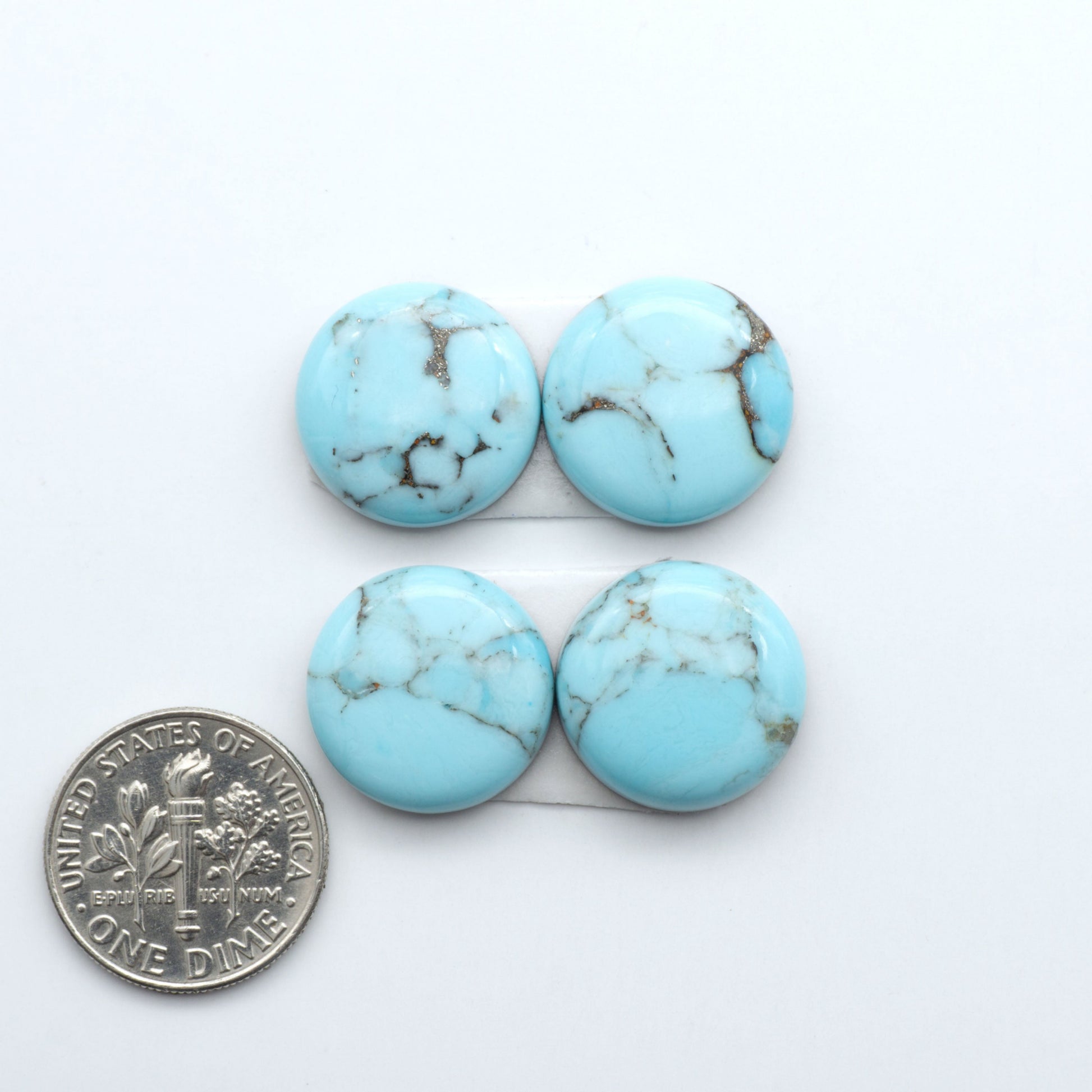 Enhance your jewelry designs with Pressed Turquoise Nugget Cabochons. Crafted from composite materials they add a captivating touch to your creations.