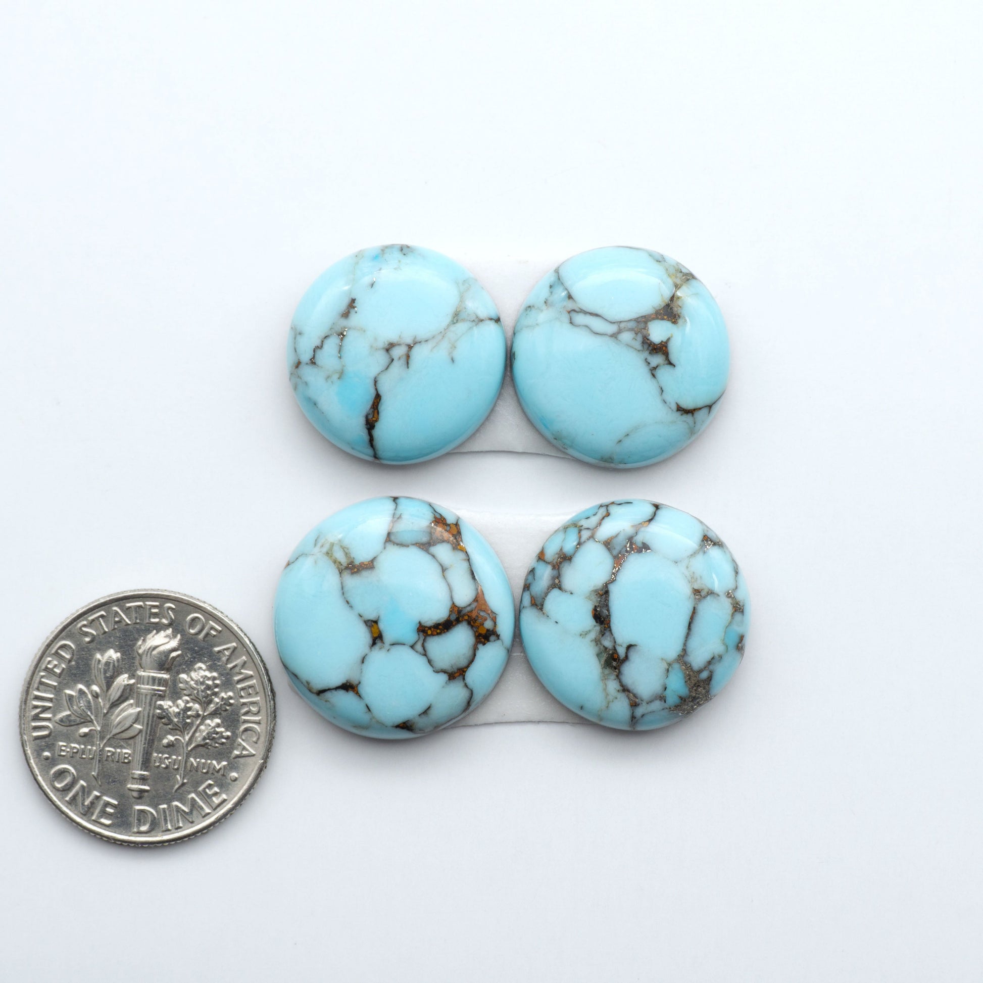 Enhance your jewelry designs with Pressed Turquoise Nugget Cabochons. Crafted from composite materials they add a captivating touch to your creations.