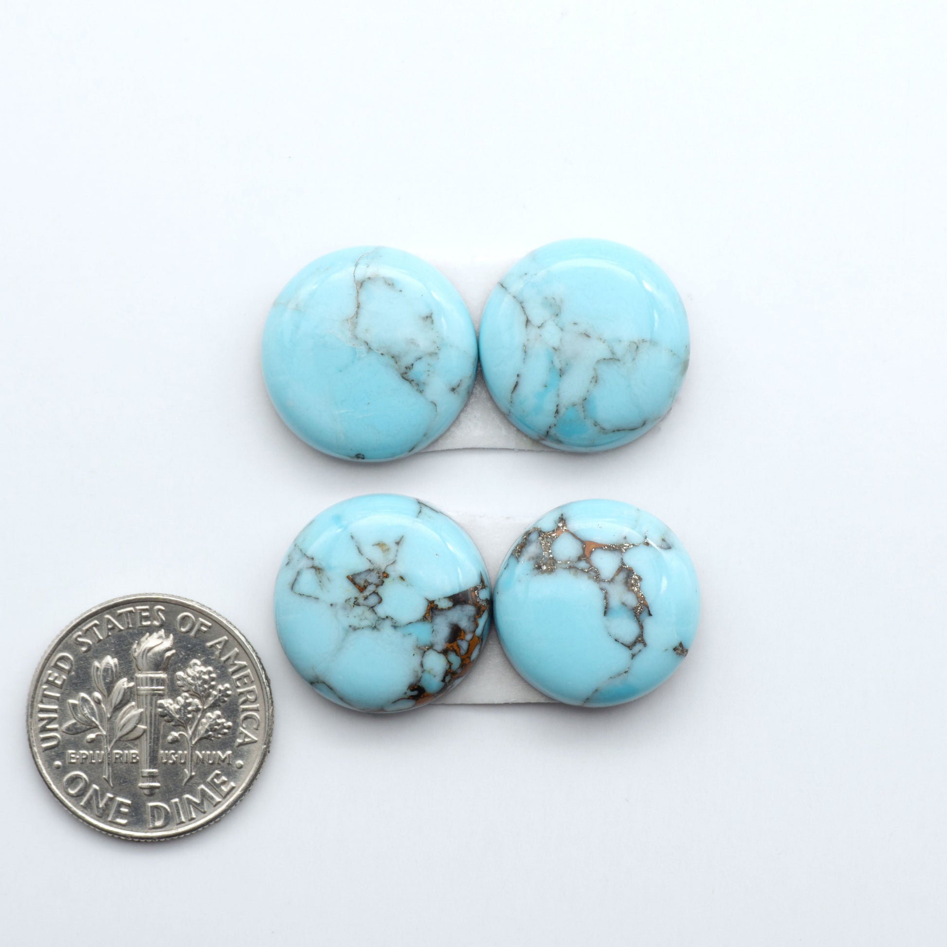 Enhance your jewelry designs with Pressed Turquoise Nugget Cabochons. Crafted from composite materials they add a captivating touch to your creations.