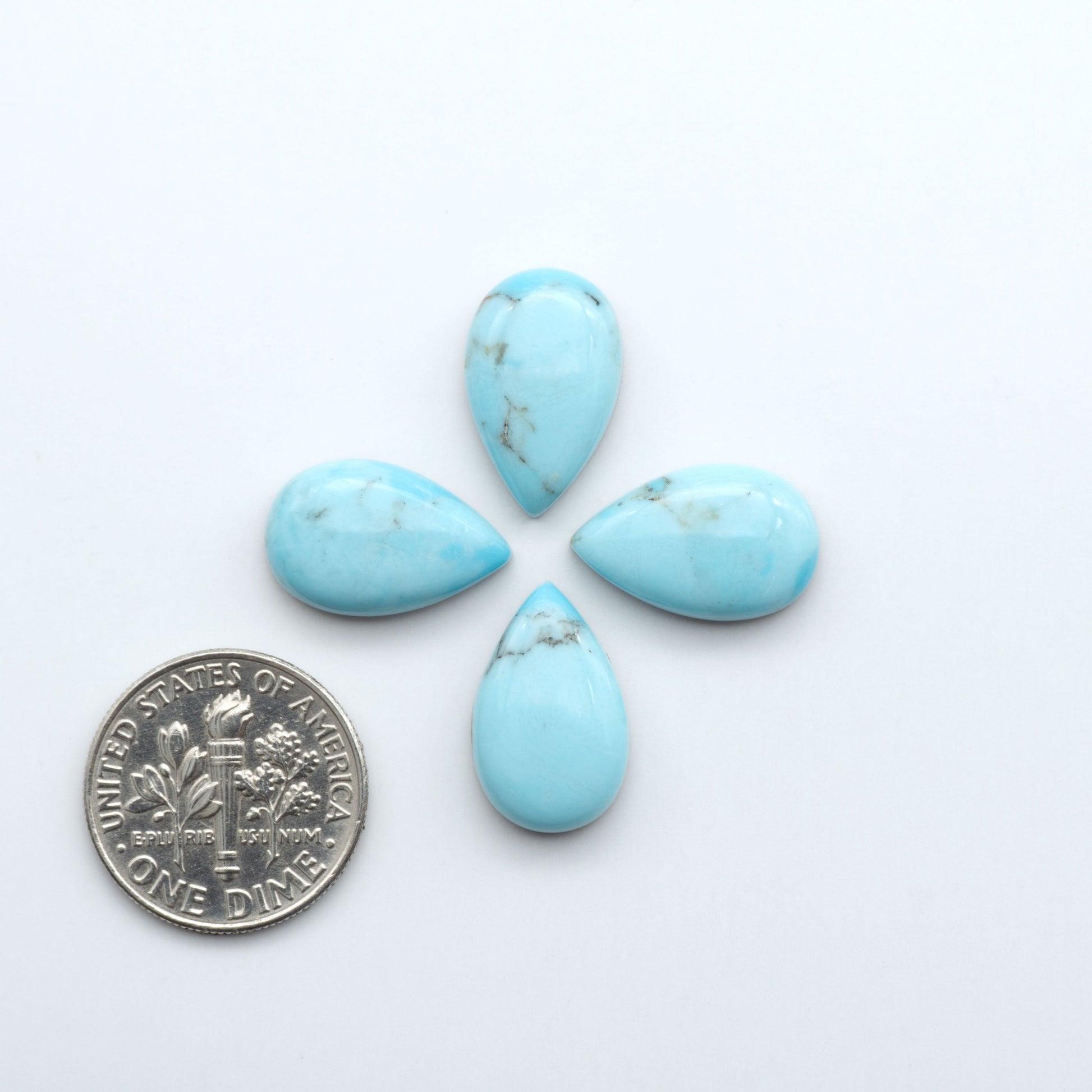 Enhance your jewelry designs with Pressed Turquoise Nugget Cabochons. Crafted from composite materials they add a captivating touch to your creations.