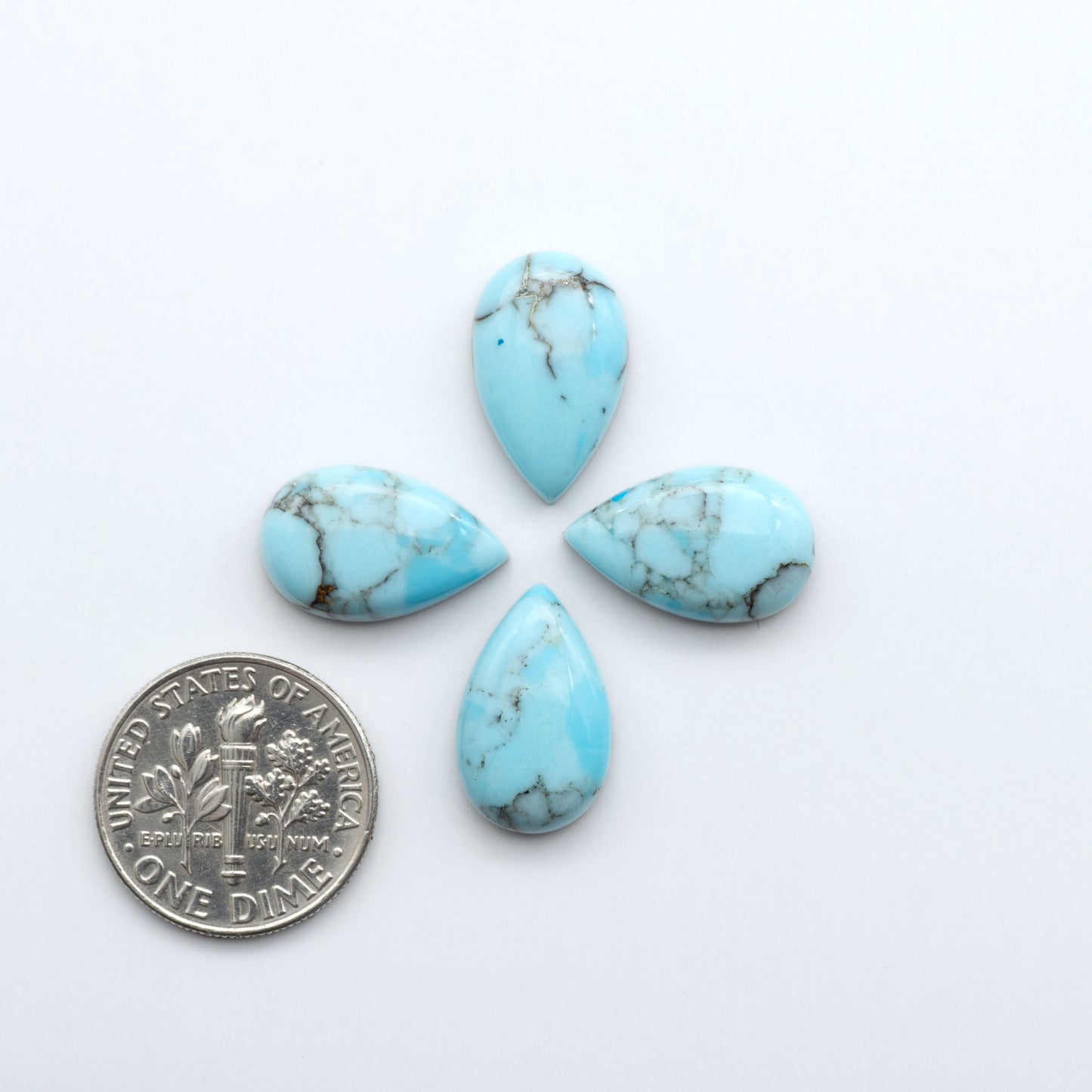 Enhance your jewelry designs with Pressed Turquoise Nugget Cabochons. Crafted from composite materials they add a captivating touch to your creations.
