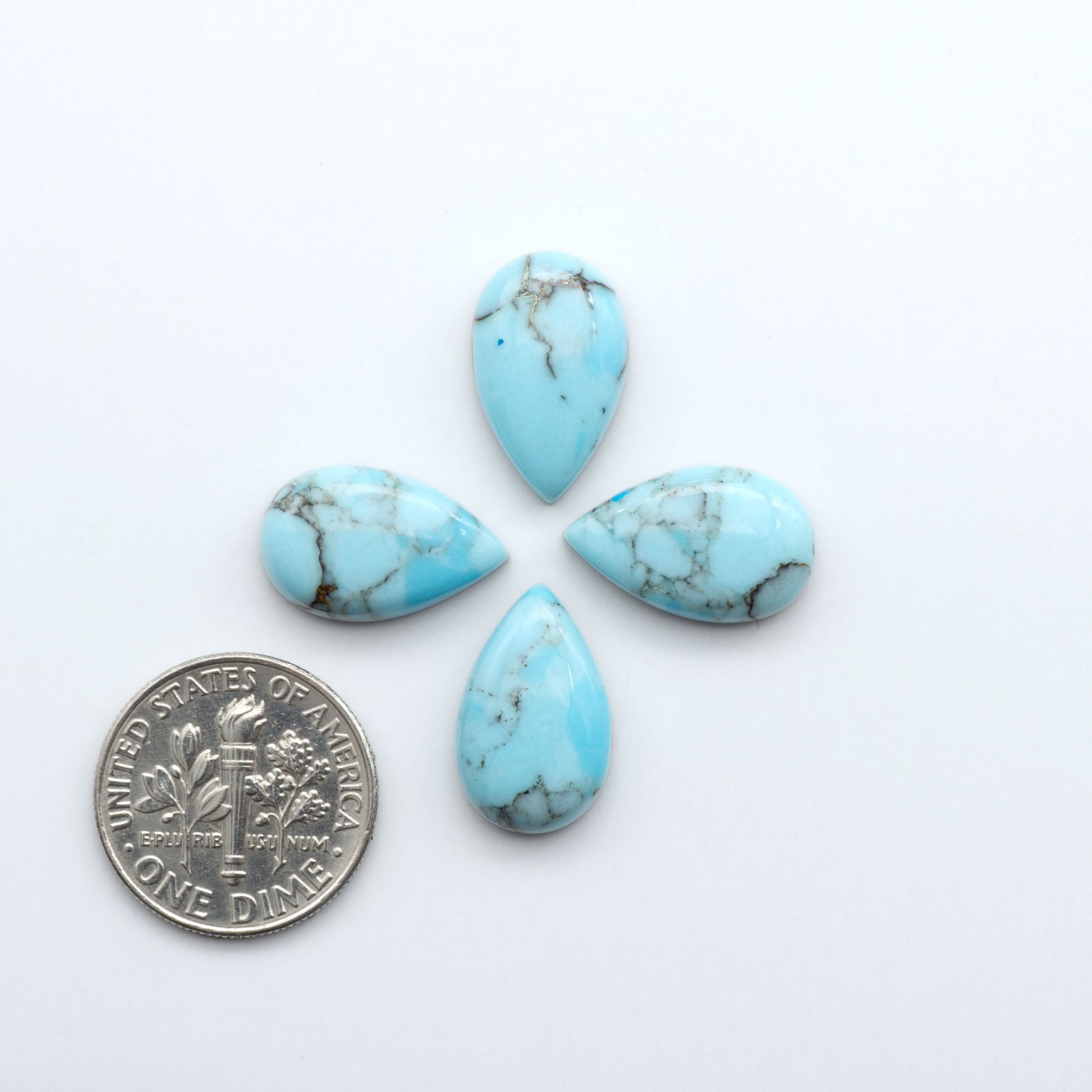 Enhance your jewelry designs with Pressed Turquoise Nugget Cabochons. Crafted from composite materials they add a captivating touch to your creations.