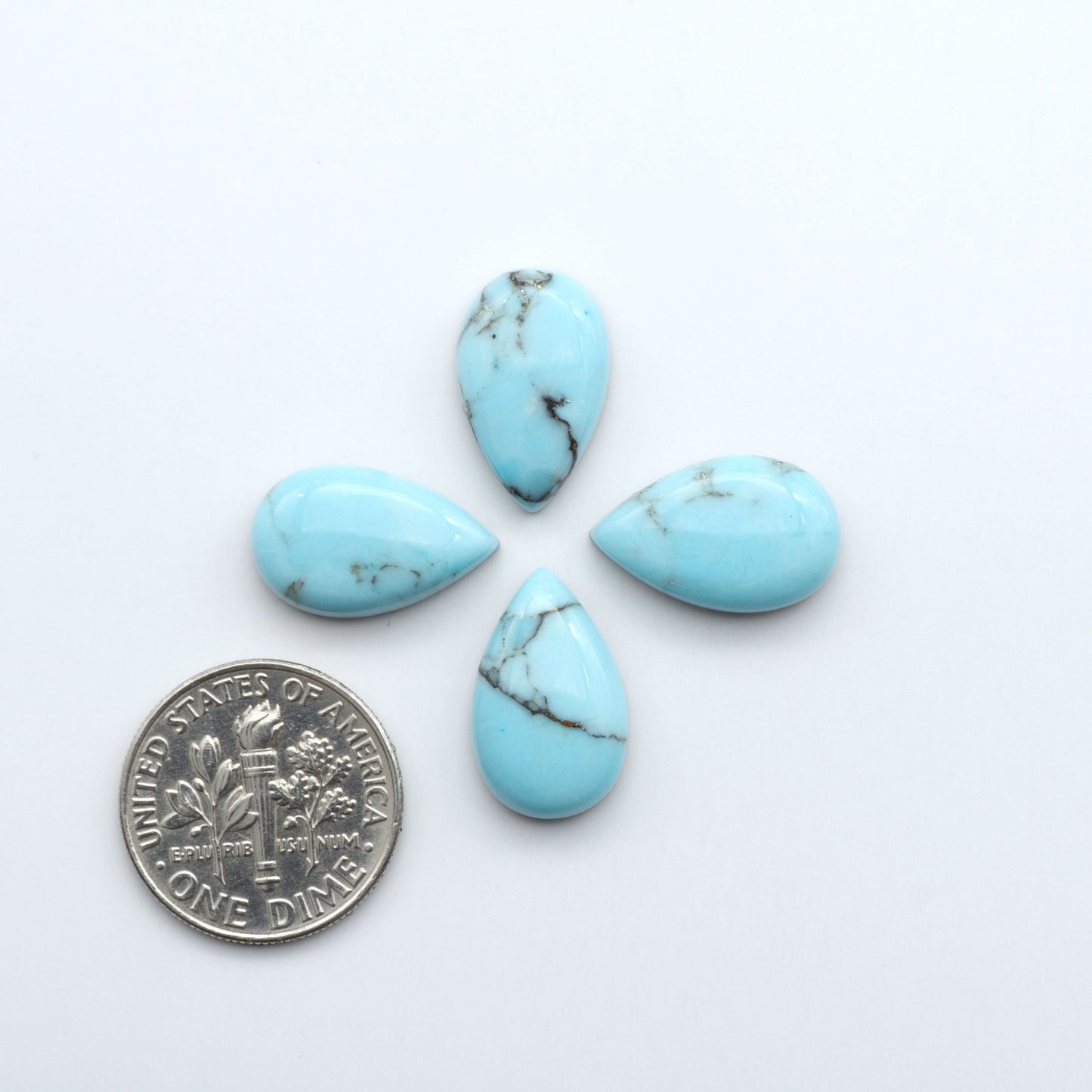 Enhance your jewelry designs with Pressed Turquoise Nugget Cabochons. Crafted from composite materials they add a captivating touch to your creations.