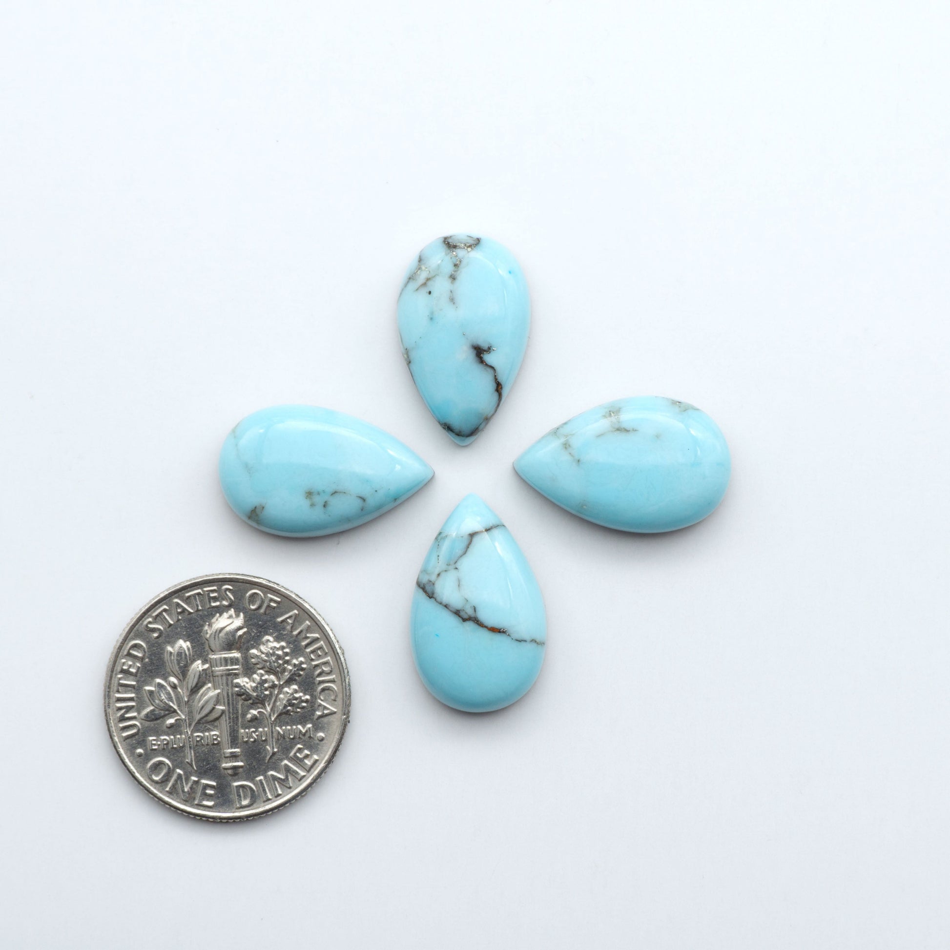 Enhance your jewelry designs with Pressed Turquoise Nugget Cabochons. Crafted from composite materials they add a captivating touch to your creations.