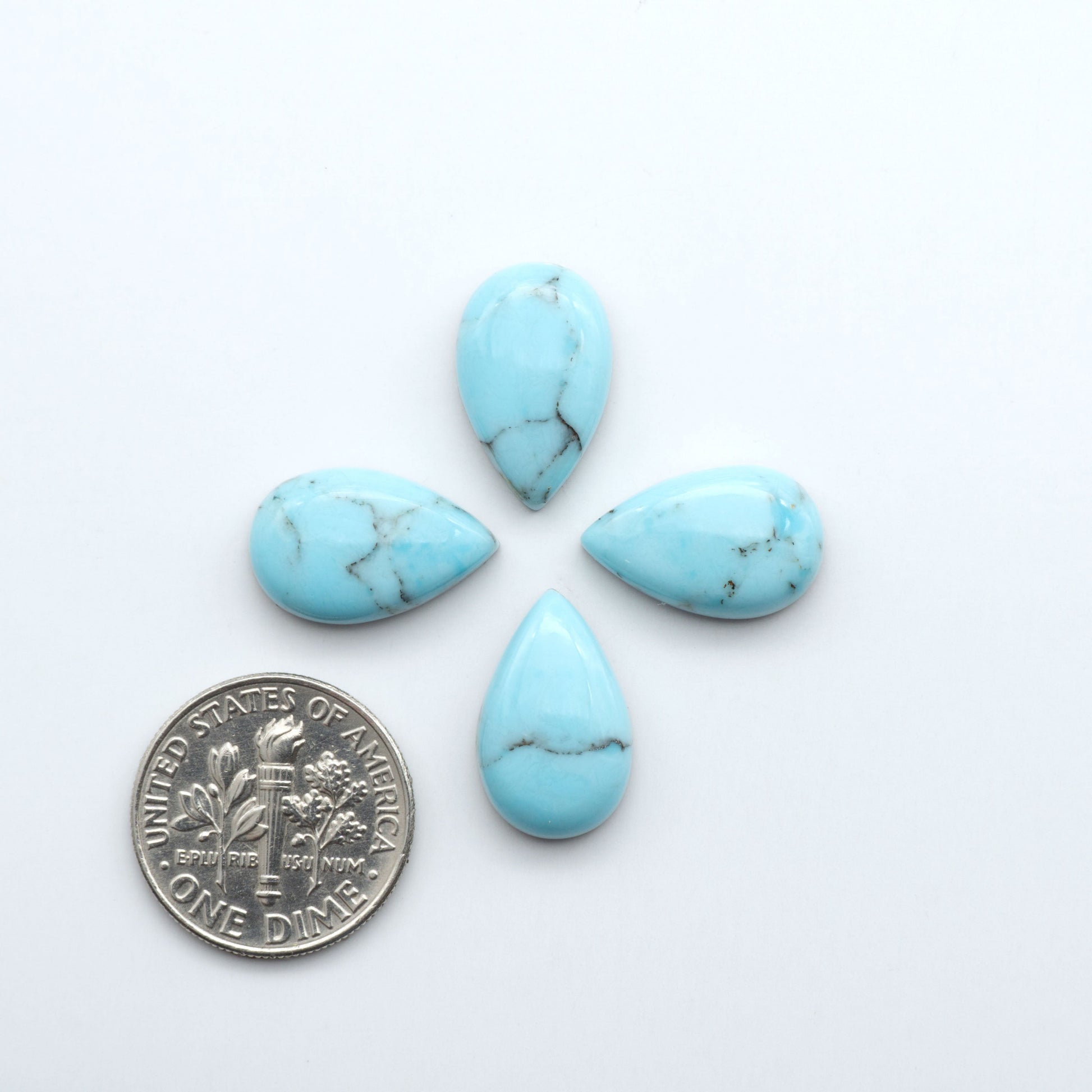 Enhance your jewelry designs with Pressed Turquoise Nugget Cabochons. Crafted from composite materials they add a captivating touch to your creations.