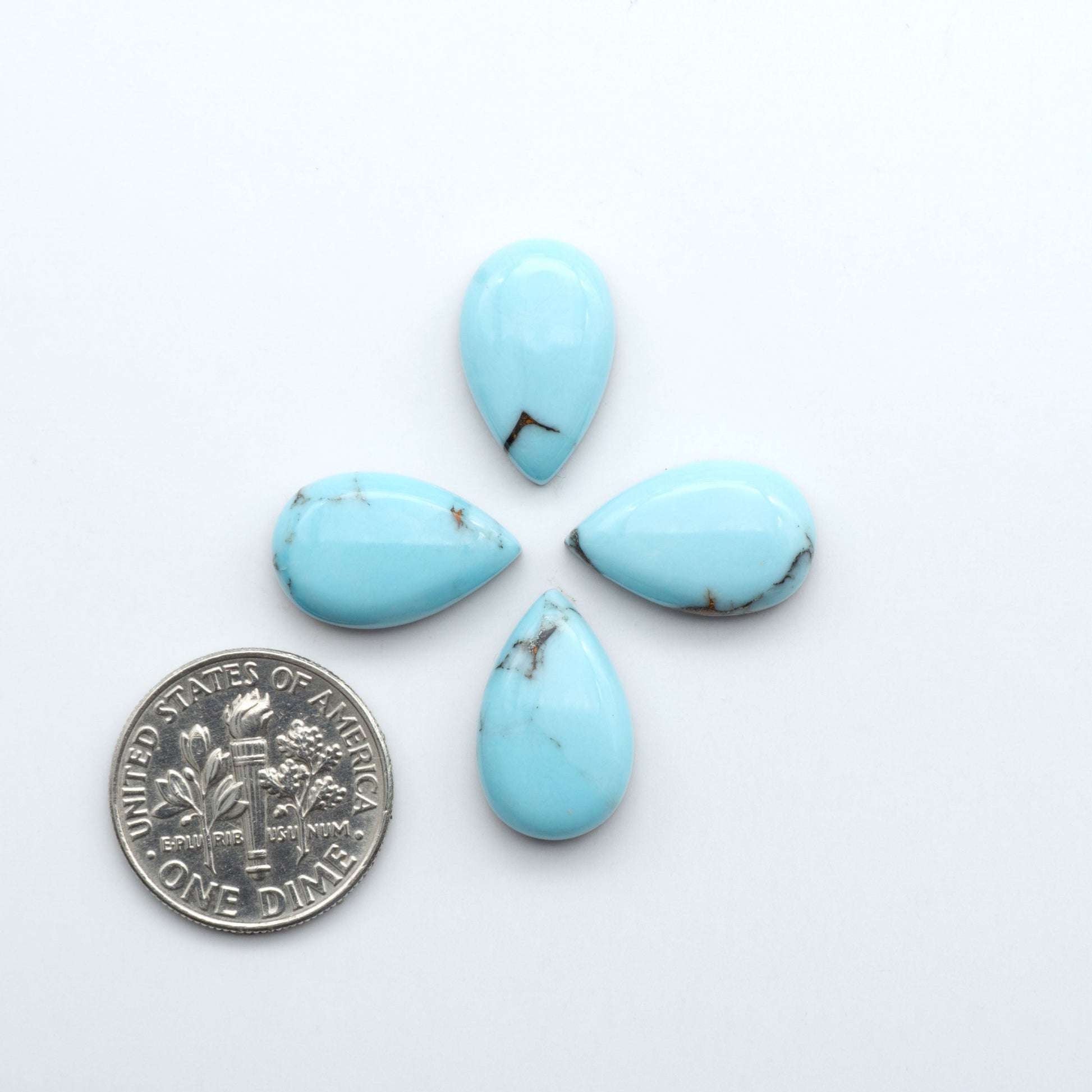 Enhance your jewelry designs with Pressed Turquoise Nugget Cabochons. Crafted from composite materials they add a captivating touch to your creations.