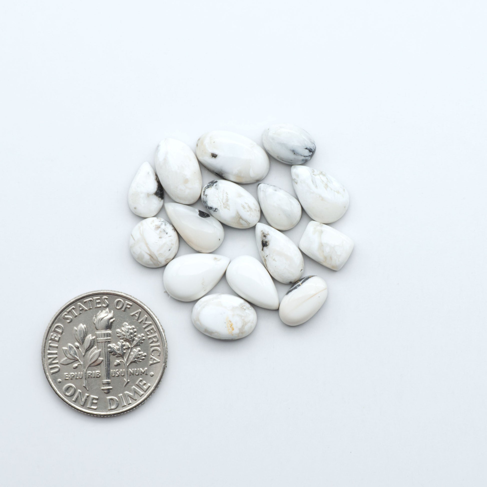 Natural White Buffalo Stone Cabochons are semi-precious gemstones cut into shapes ideal for jewelry-making, making them an excellent choice for artisans.

