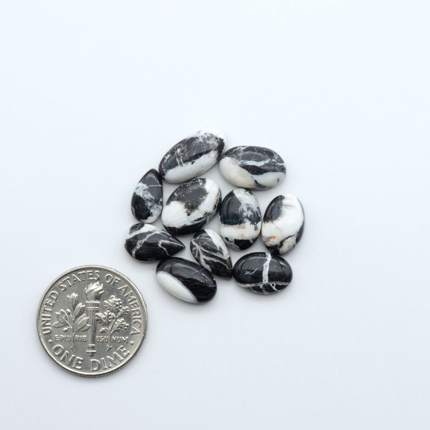 Natural White Buffalo Stone Cabochons are semi-precious gemstones cut into shapes ideal for jewelry-making, making them an excellent choice for artisans.

