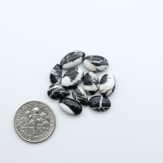 Natural White Buffalo Stone Cabochons are semi-precious gemstones cut into shapes ideal for jewelry-making, making them an excellent choice for artisans.

