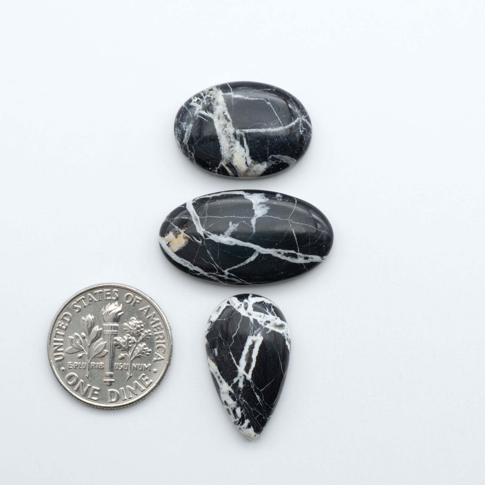 Natural White Buffalo Stone Cabochons are semi-precious gemstones cut into shapes ideal for jewelry-making, making them an excellent choice for artisans.

