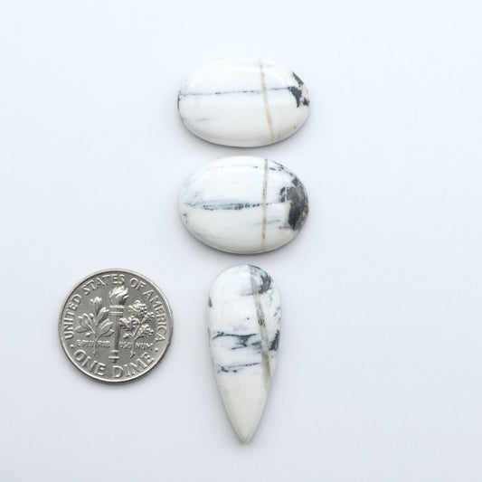 Natural White Buffalo Stone Cabochons are semi-precious gemstones cut into shapes ideal for jewelry-making, making them an excellent choice for artisans.

