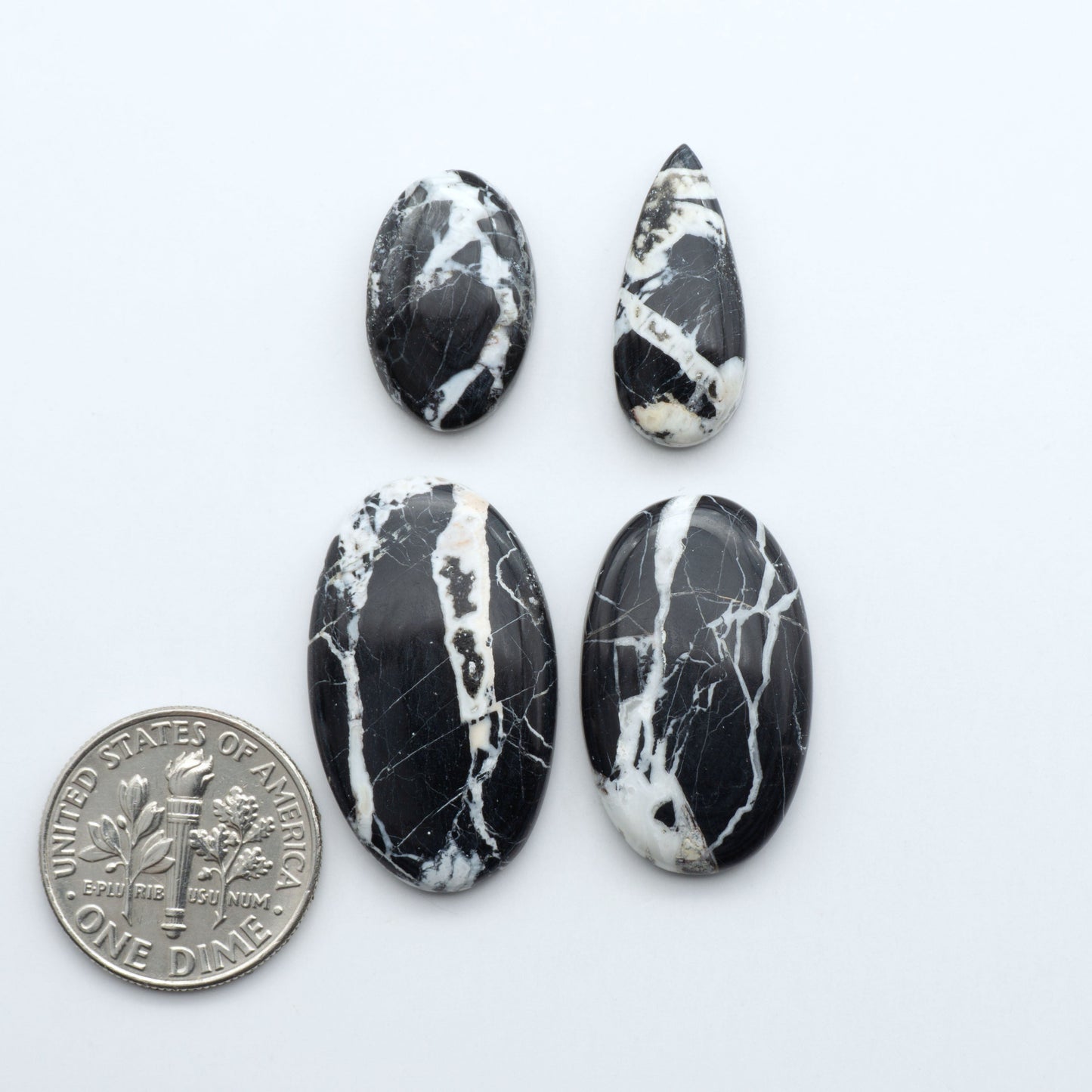 Natural White Buffalo Stone Cabochons are semi-precious gemstones cut into shapes ideal for jewelry-making, making them an excellent choice for artisans.

