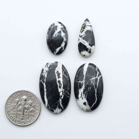 Natural White Buffalo Stone Cabochons are semi-precious gemstones cut into shapes ideal for jewelry-making, making them an excellent choice for artisans.

