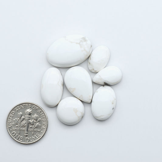 Natural White Buffalo Stone Cabochons are semi-precious gemstones cut into shapes ideal for jewelry-making, making them an excellent choice for artisans.

