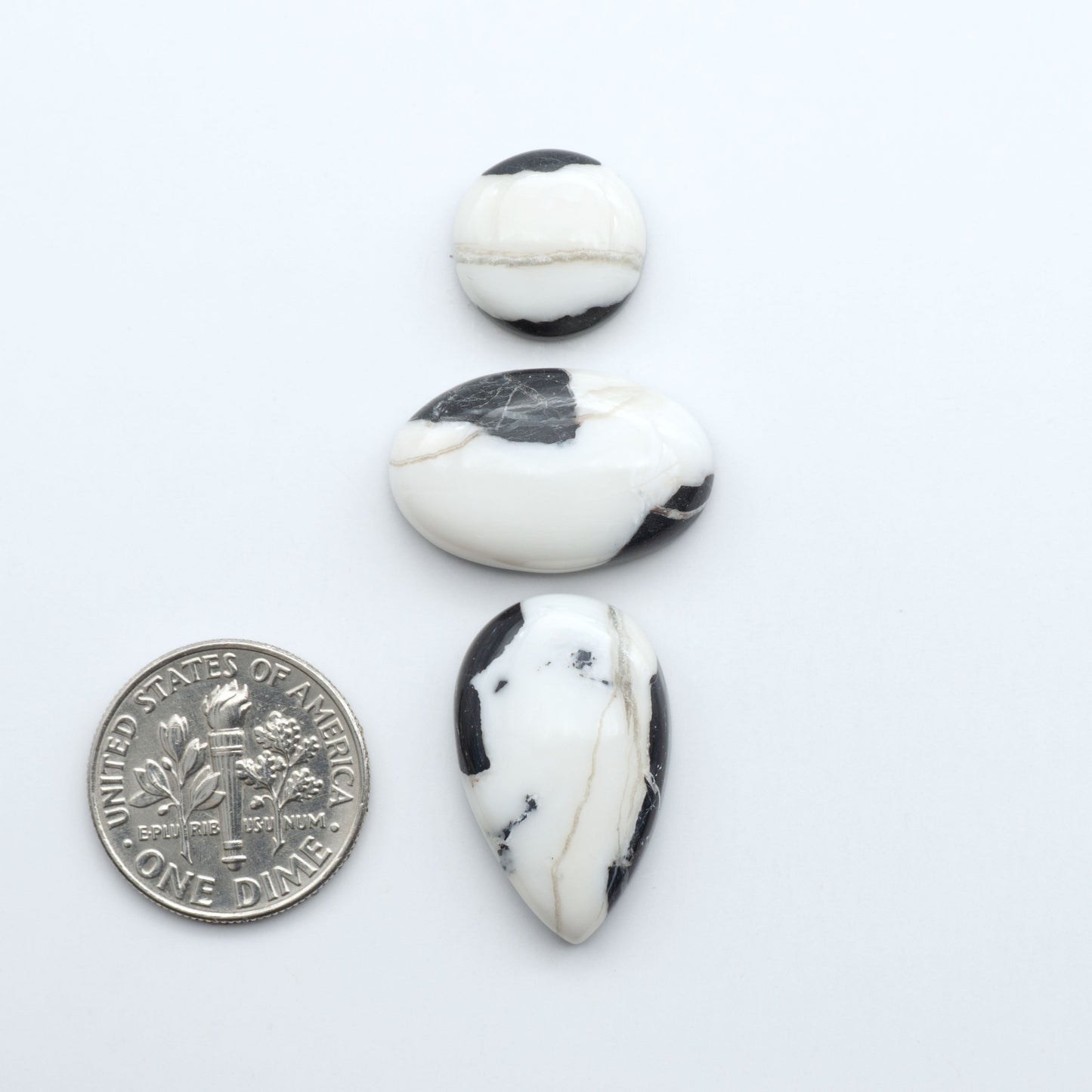 Natural White Buffalo Stone Cabochons are semi-precious gemstones cut into shapes ideal for jewelry-making, making them an excellent choice for artisans.

