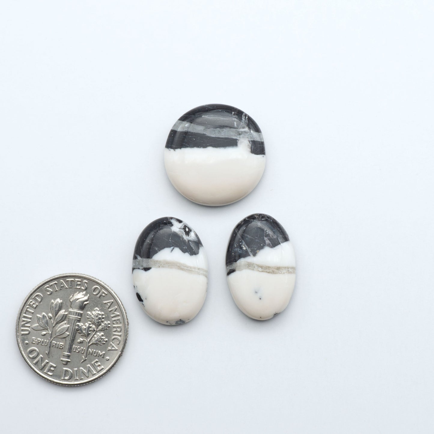 Natural White Buffalo Stone Cabochons are semi-precious gemstones cut into shapes ideal for jewelry-making, making them an excellent choice for artisans.

