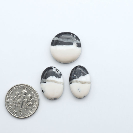 Natural White Buffalo Stone Cabochons are semi-precious gemstones cut into shapes ideal for jewelry-making, making them an excellent choice for artisans.

