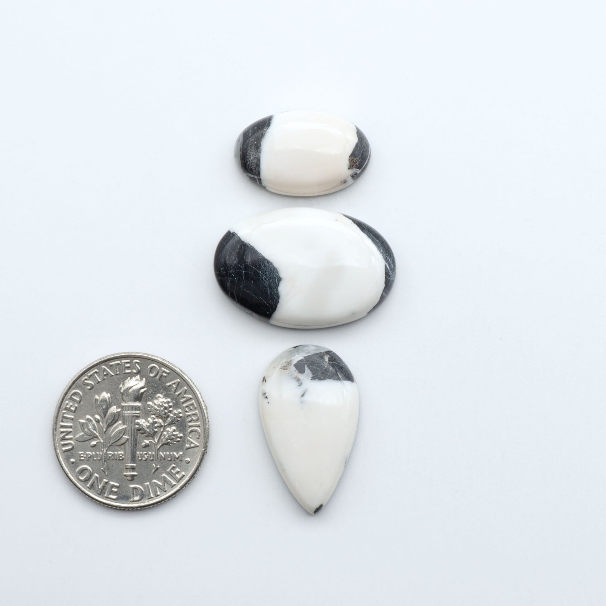Natural White Buffalo Stone Cabochons are semi-precious gemstones cut into shapes ideal for jewelry-making, making them an excellent choice for artisans.

