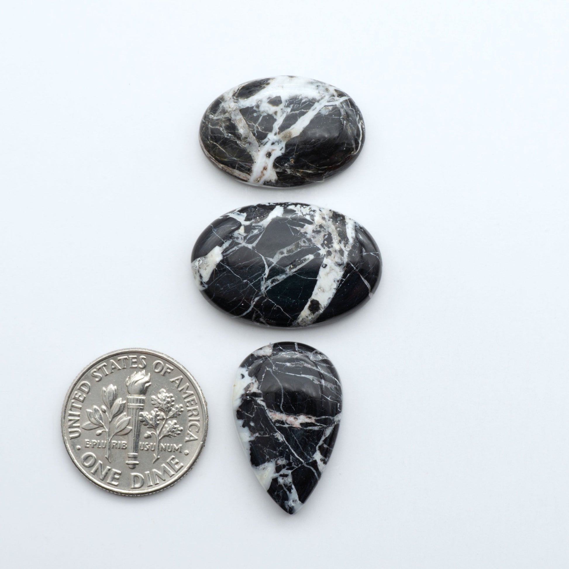 Natural White Buffalo Stone Cabochons are semi-precious gemstones cut into shapes ideal for jewelry-making, making them an excellent choice for artisans.

