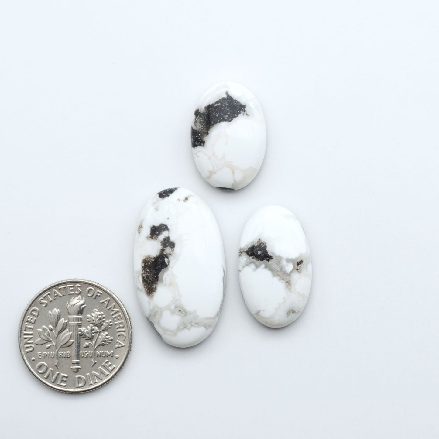 Natural White Buffalo Stone Cabochons are semi-precious gemstones cut into shapes ideal for jewelry-making, making them an excellent choice for artisans.

