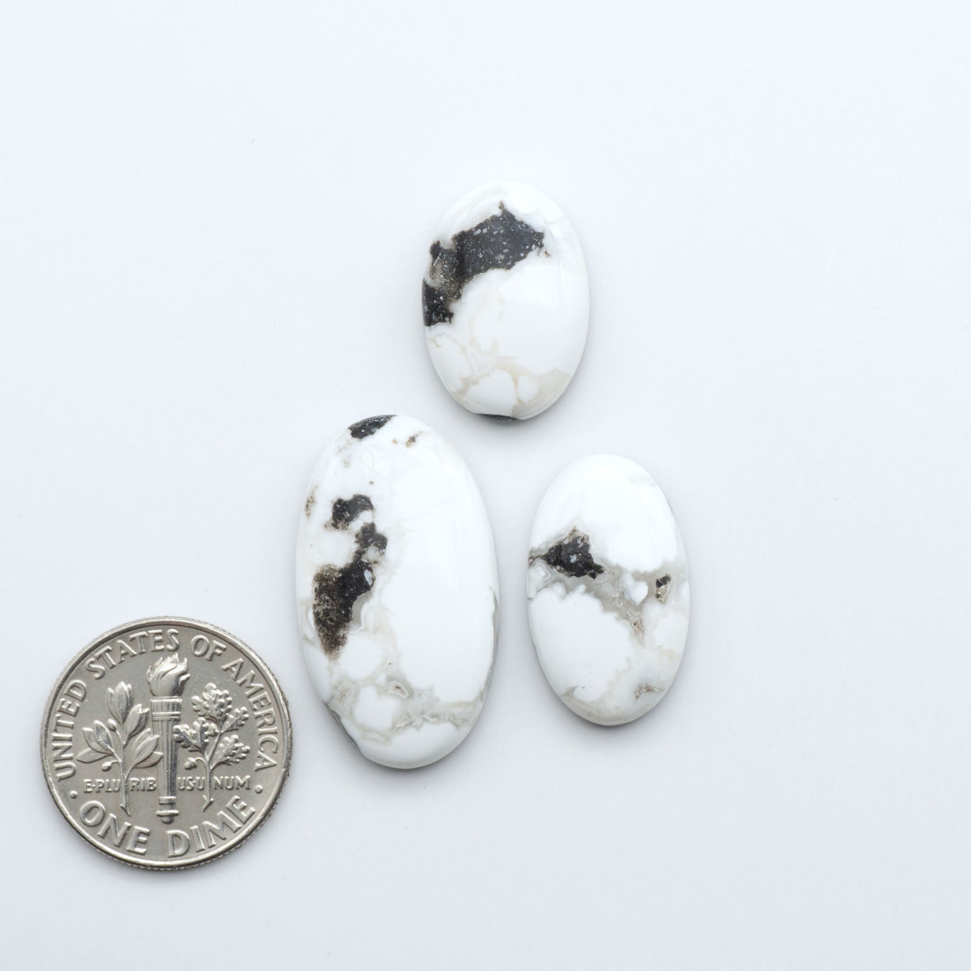 Natural White Buffalo Stone Cabochons are semi-precious gemstones cut into shapes ideal for jewelry-making, making them an excellent choice for artisans.

