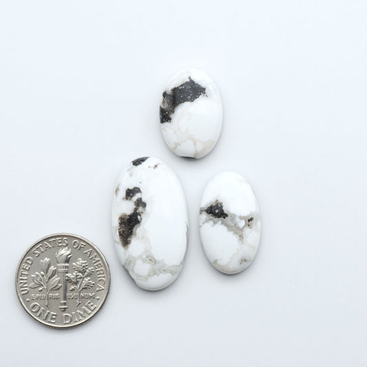 Natural White Buffalo Stone Cabochons are semi-precious gemstones cut into shapes ideal for jewelry-making, making them an excellent choice for artisans.

