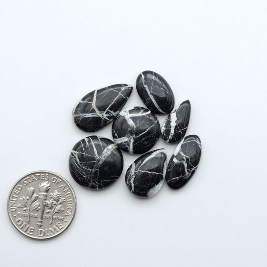 Natural White Buffalo Stone Cabochons are semi-precious gemstones cut into shapes ideal for jewelry-making, making them an excellent choice for artisans.

