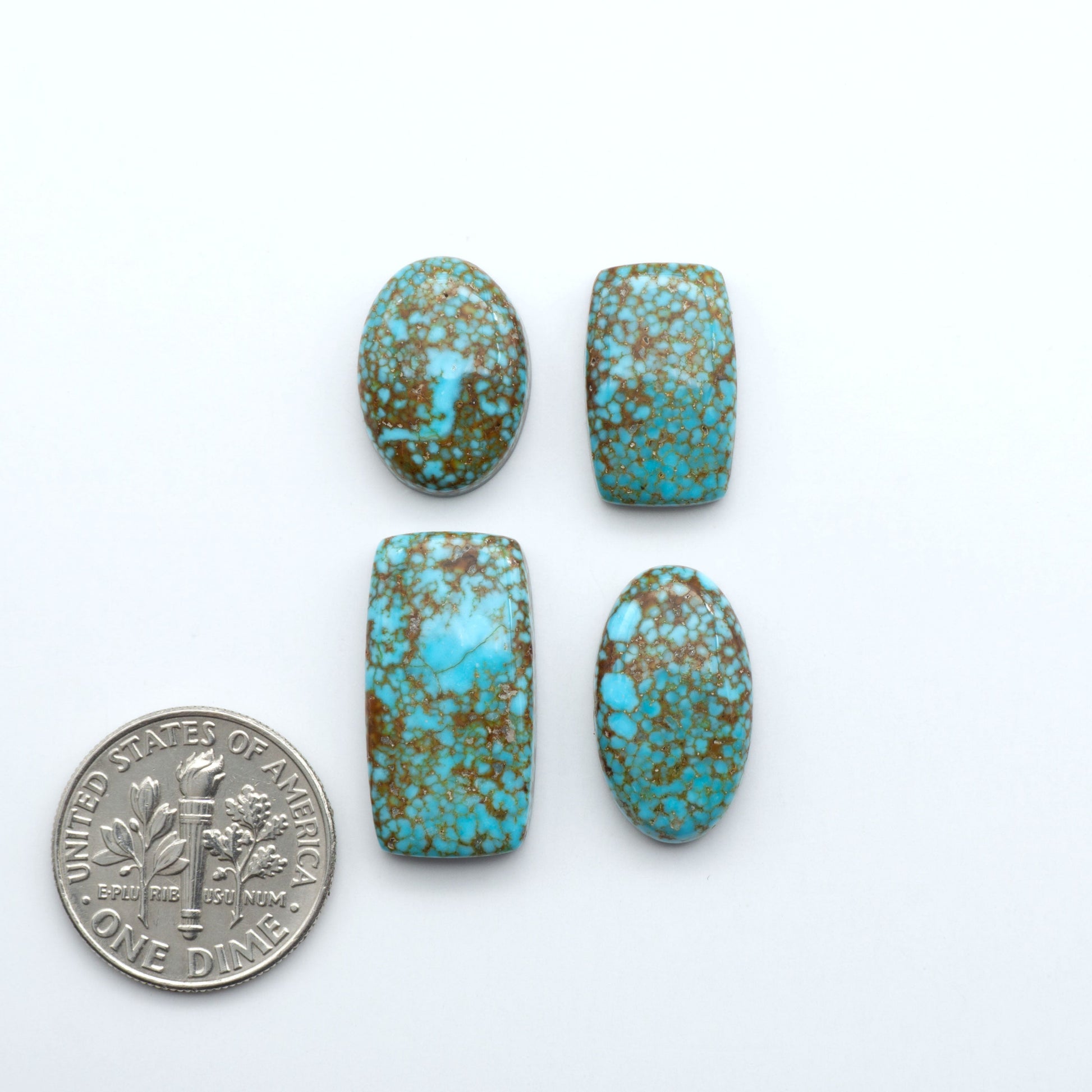 Kingman Turquoise Cabochons are a staple in the jewelry industry, known for their stunning blue-green color. Perfect for necklaces, earrings, and more!