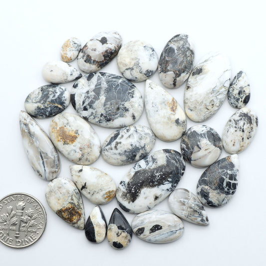 Natural White Buffalo Stone Cabochons are semi-precious gemstones cut into shapes ideal for jewelry-making, making them an excellent choice for artisans.


